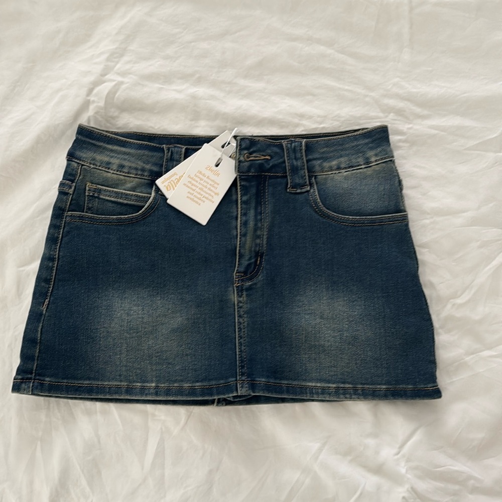 Denim mini skirt with shorts liner.